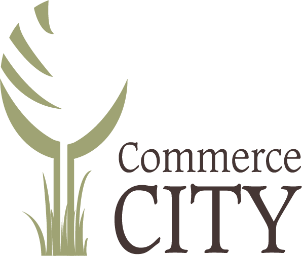 Commerce City logo with stylized green tree and grass design